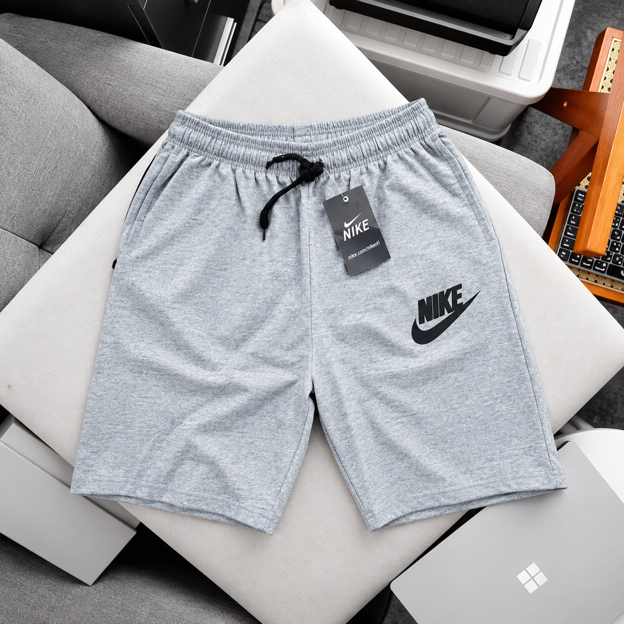 Nike Grey Shorts on a Cream Cushion